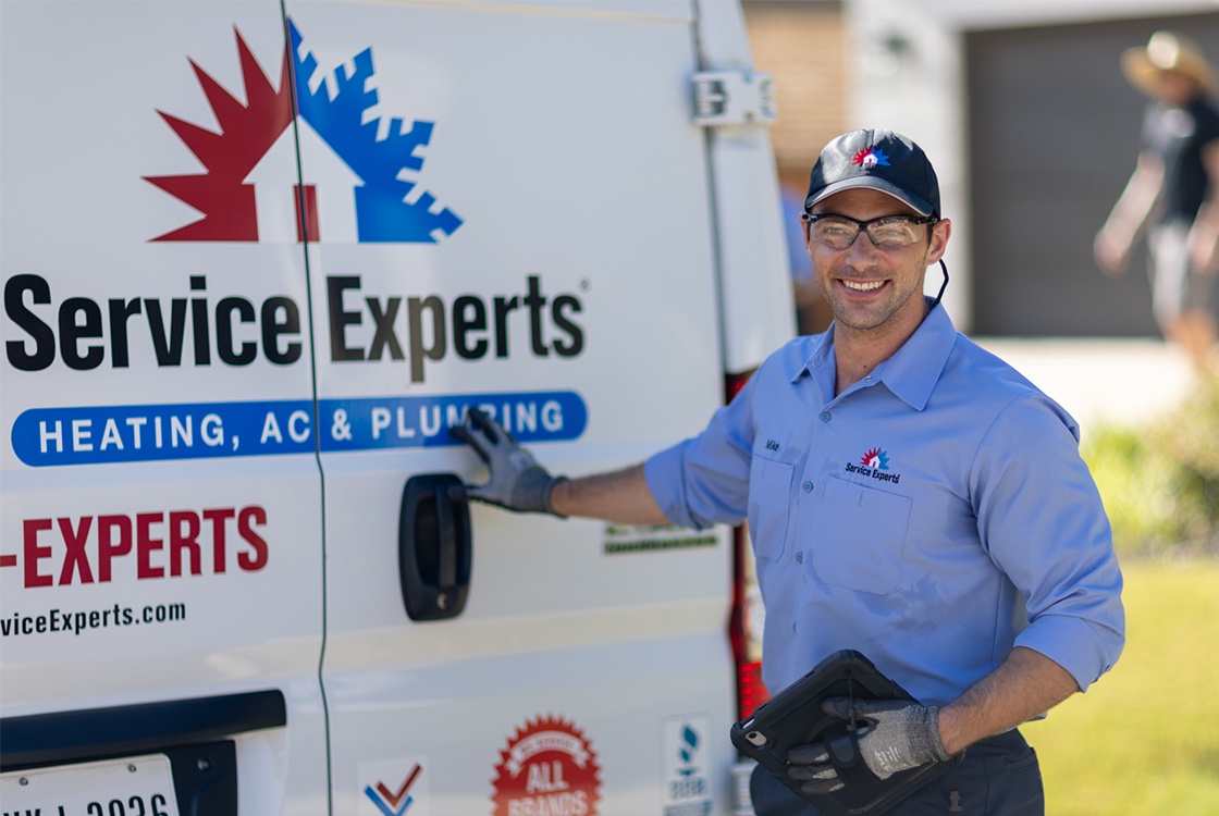 HVAC technician explaining findings to home owner